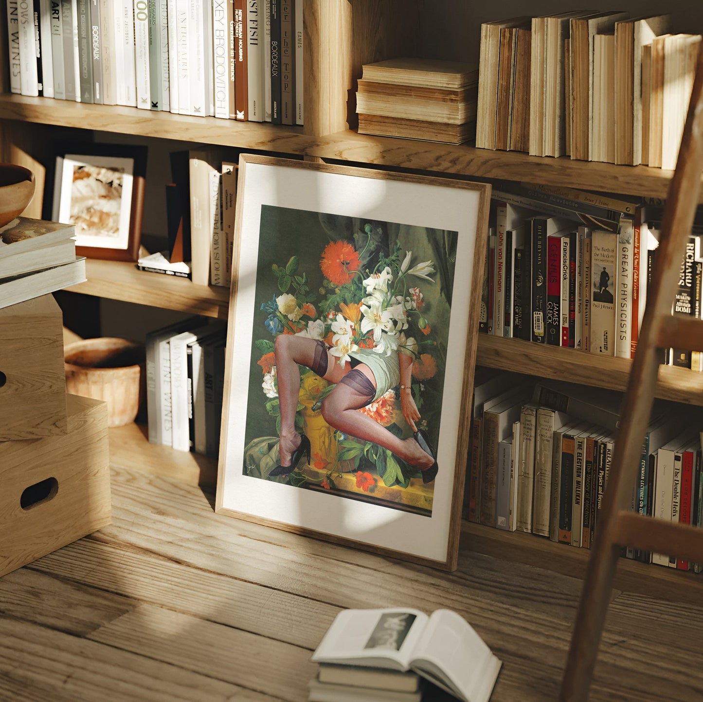 A framed art print featuring a vintage-style illustration of a woman in a floral setting, leaning against a wooden bookshelf in a cozy, sunlit room with books and a wooden ladder.