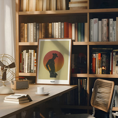 Bookshelf with books, a framed picture, a chair, and a small table with a cup.