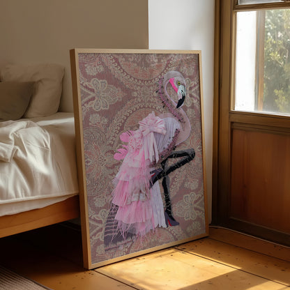 A framed art print featuring a pink flamingo on a patterned background, leaning against a bed in a sunlit bedroom.