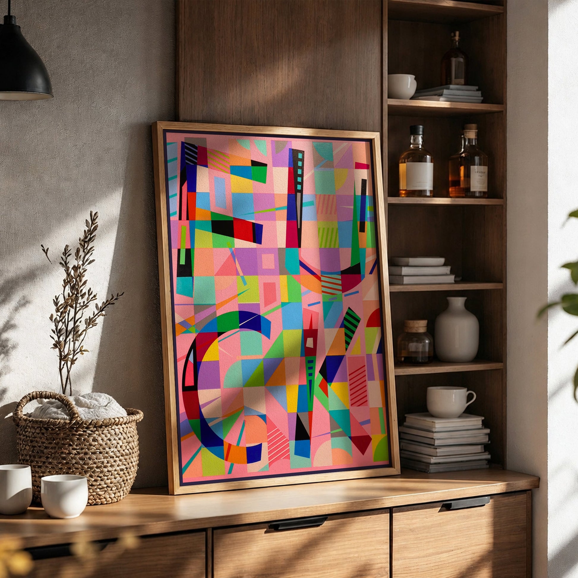 Colorful abstract art piece on a wooden shelf with books and decor items.