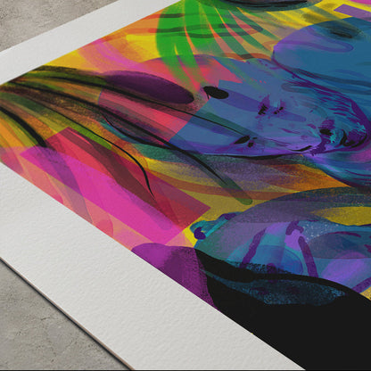 A colorful abstract art print with a wide white border, photographed at an angle on a gray concrete floor. The artwork features a vibrant mix of pink, blue, purple, green, yellow, and black brushstrokes.