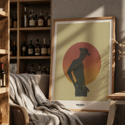 Framed artwork of a silhouette against a sunset background in a cozy room with shelves and decor.