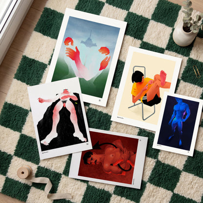 Five art prints with white borders are arranged on a green and cream checkered rug. The prints feature surreal illustrations, including hands reaching up, a seated figure in a yellow shirt, a black-and-pink abstract figure, a blue human figure, and a red-toned portrait.